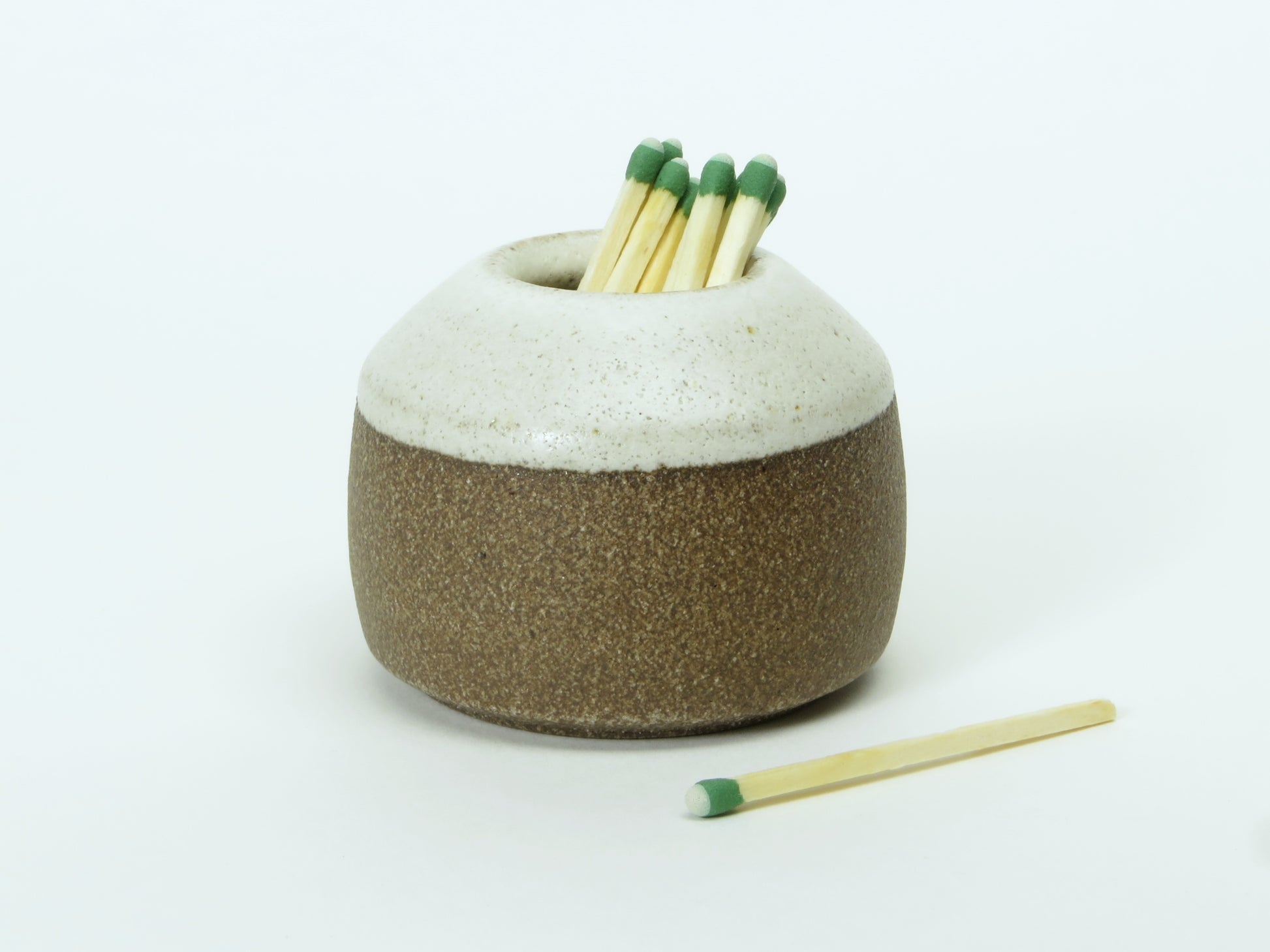 stoneware match striker with satin white glaze on top