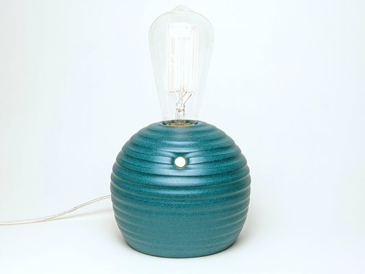 handcrafted smooth stoneware touch lamp in satin green glaze.