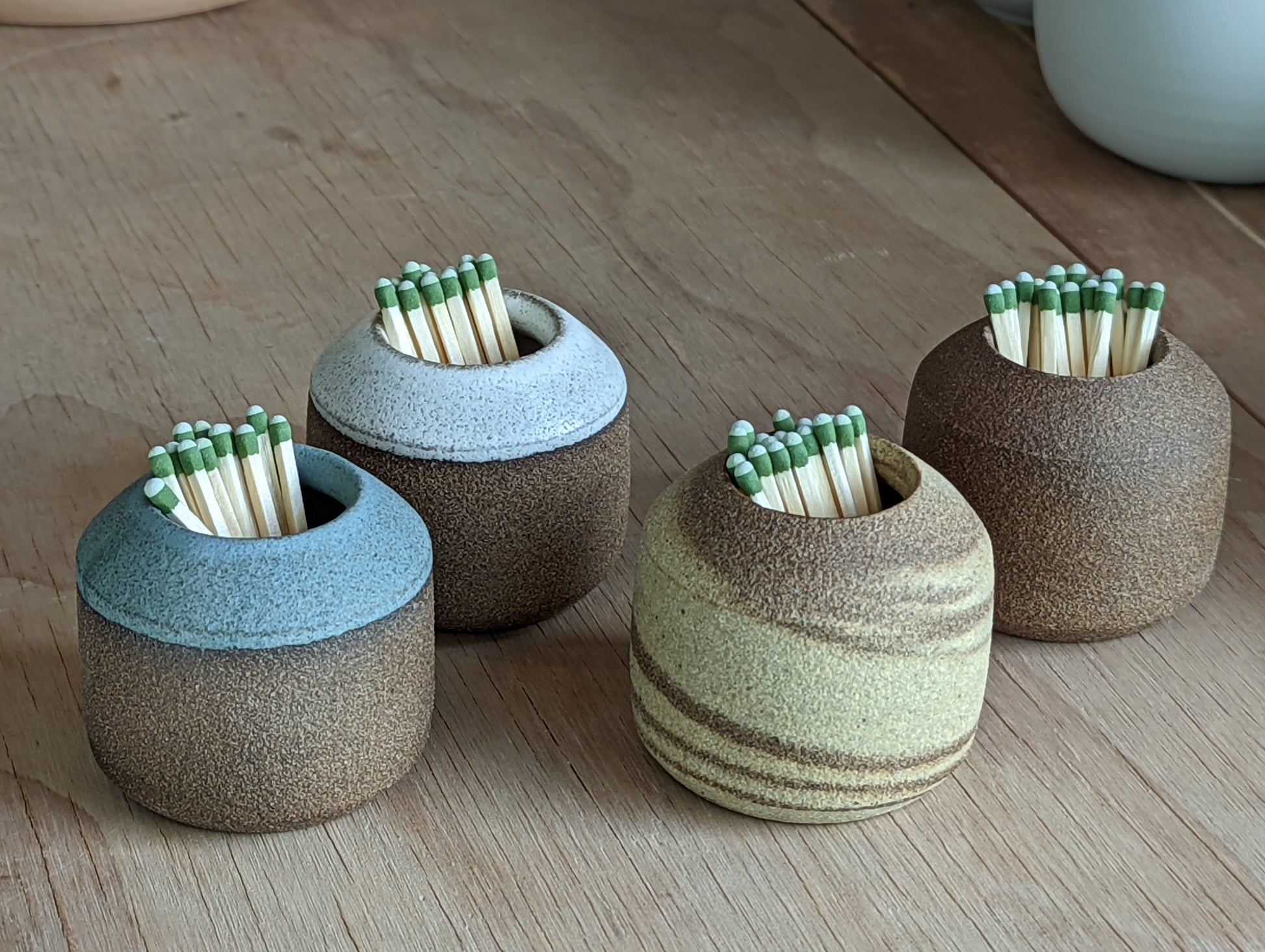 Stoneware match strikers in a variety of colores