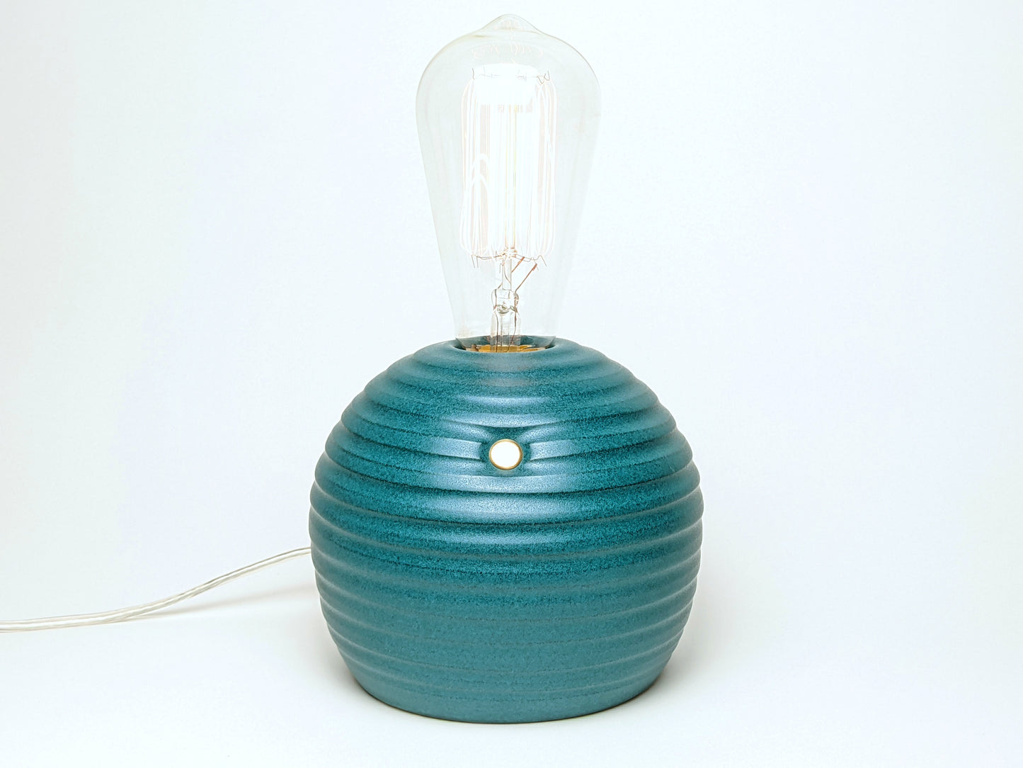 handcrafted smooth stoneware touch lamp in satin green glaze.