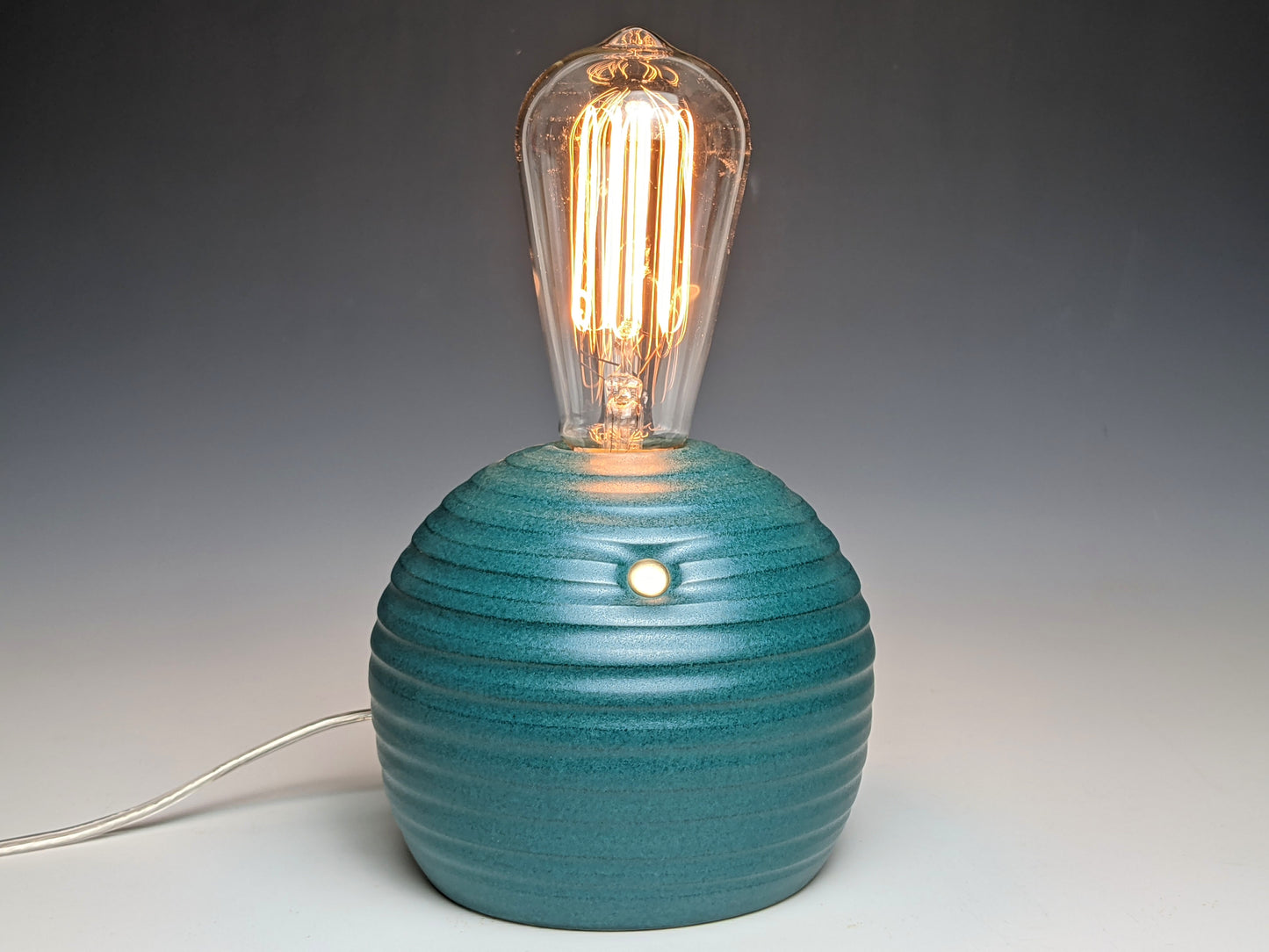 handcrafted smooth stoneware touch lamp in satin green glaze.
