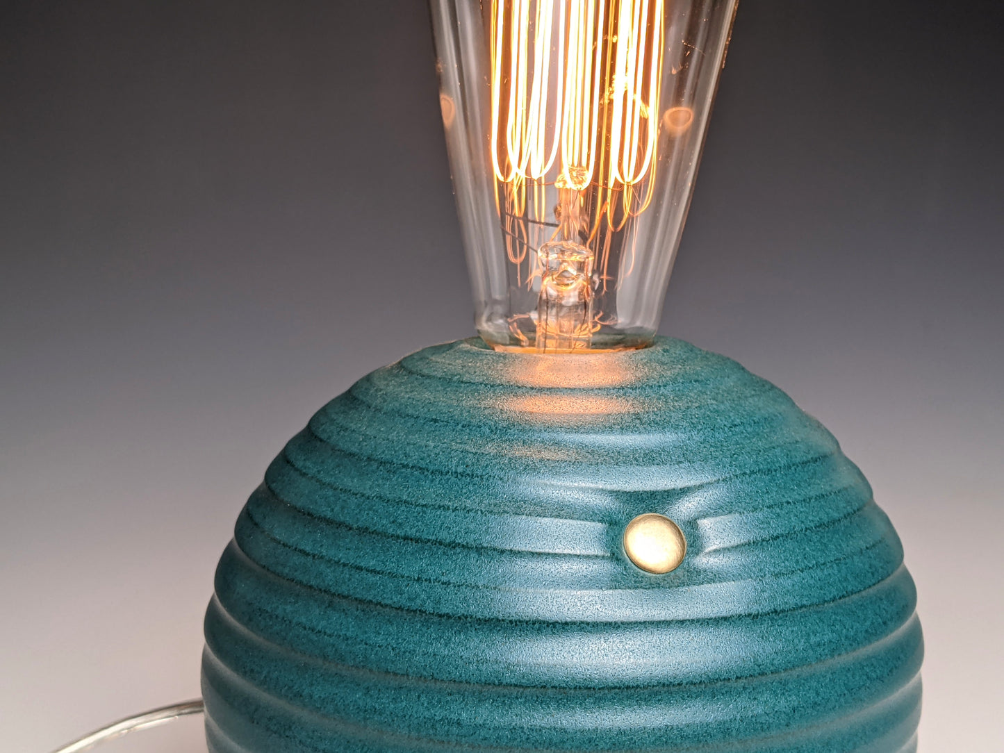 handcrafted smooth stoneware touch lamp in satin green glaze.