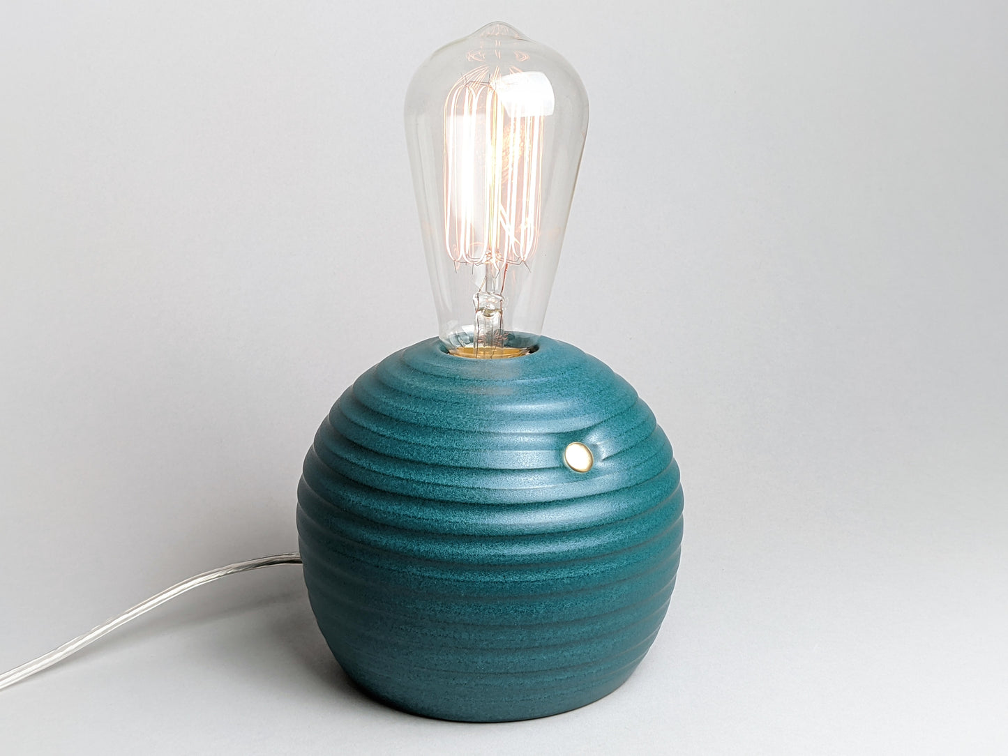 handcrafted smooth stoneware touch lamp in satin green glaze.