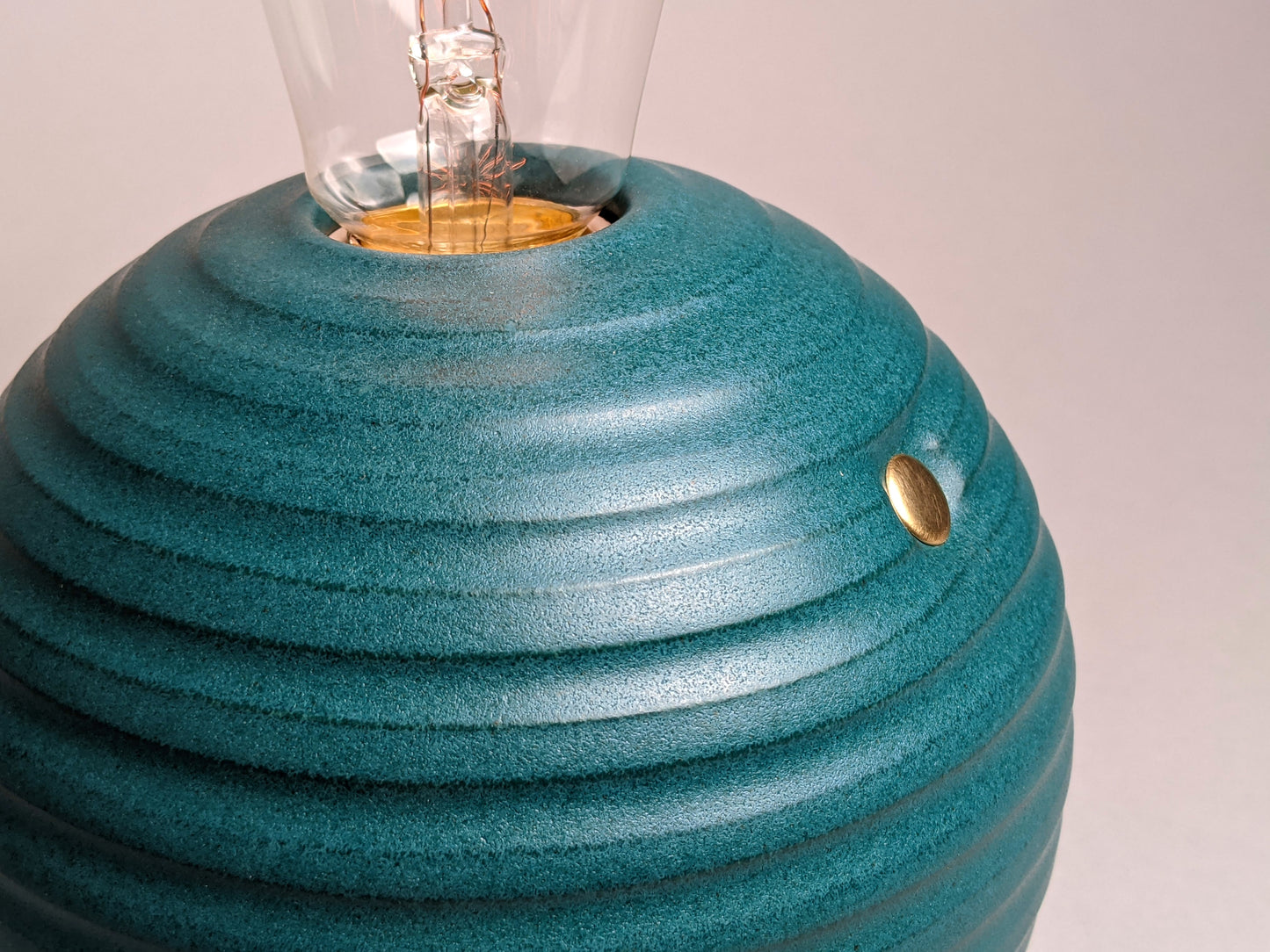 handcrafted smooth stoneware touch lamp in satin green glaze.