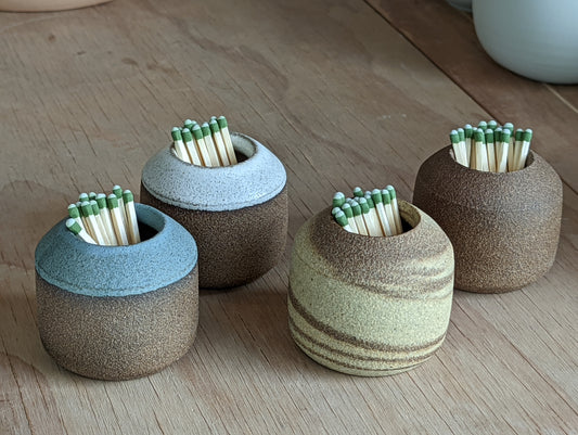 Stoneware match strikers in a variety of colores